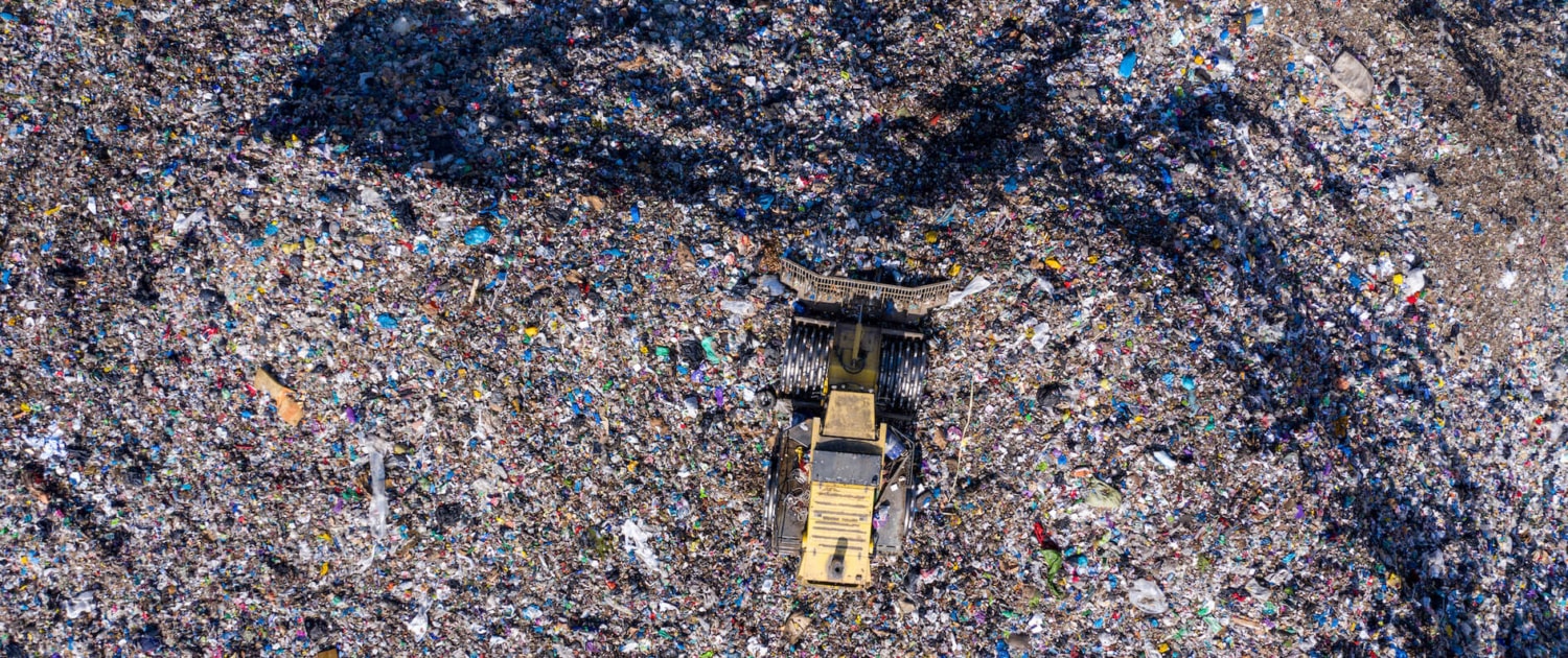 aerial-drone-view-of-bulldozer-working-on-landfill